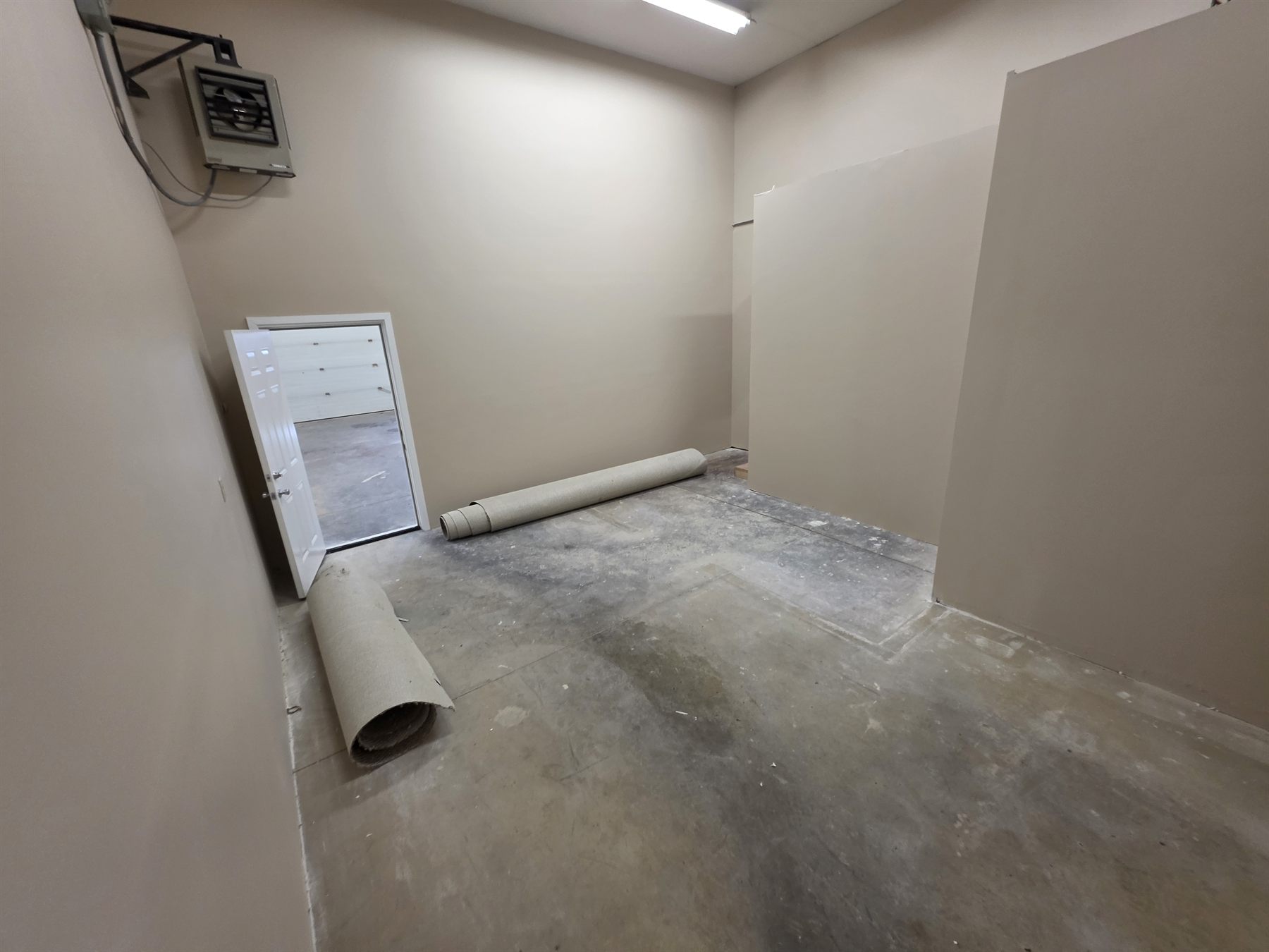 Second room with carpet removed for flooring preparation