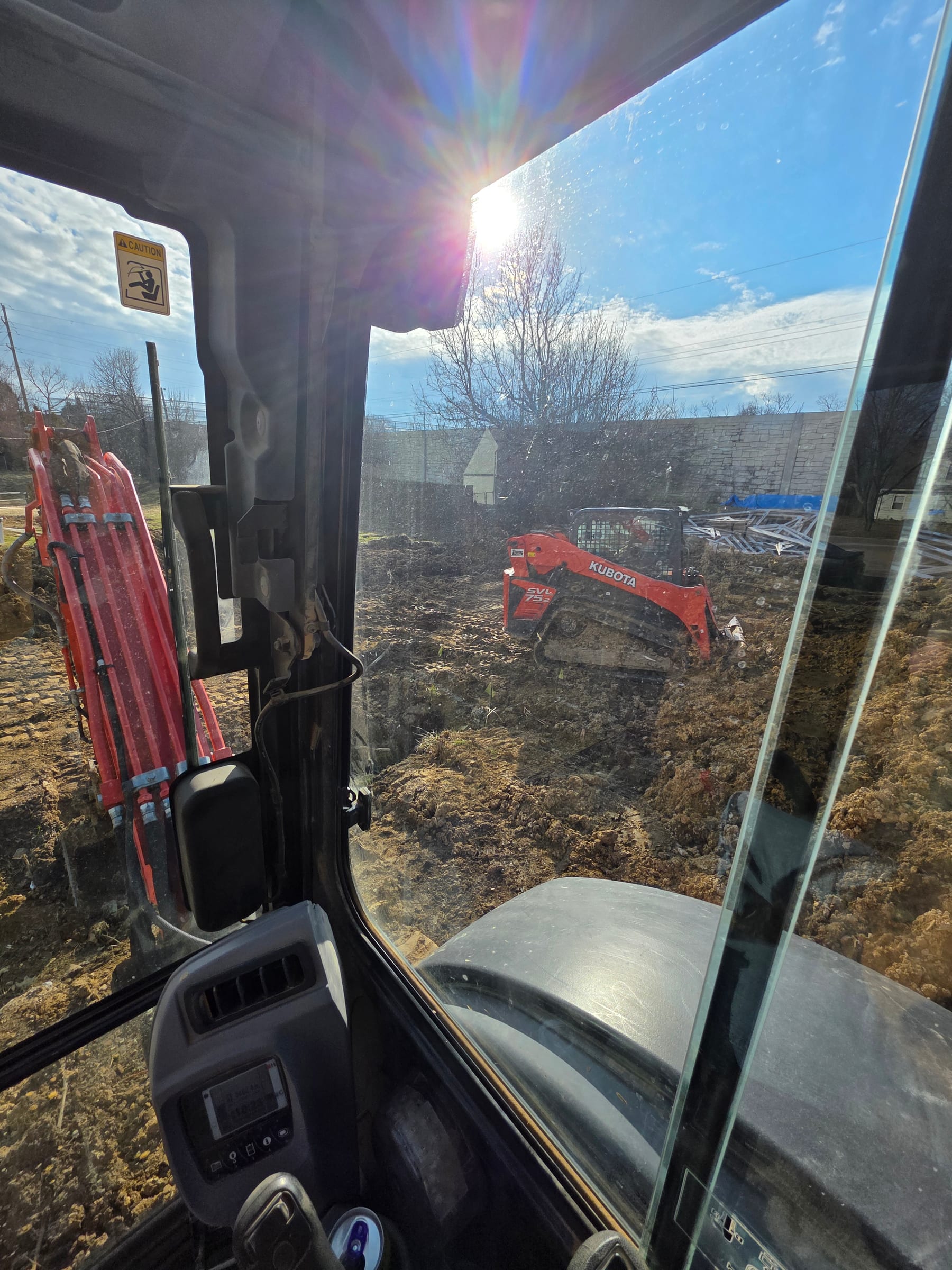 Excavator and compact track loader working within the renewed footprint