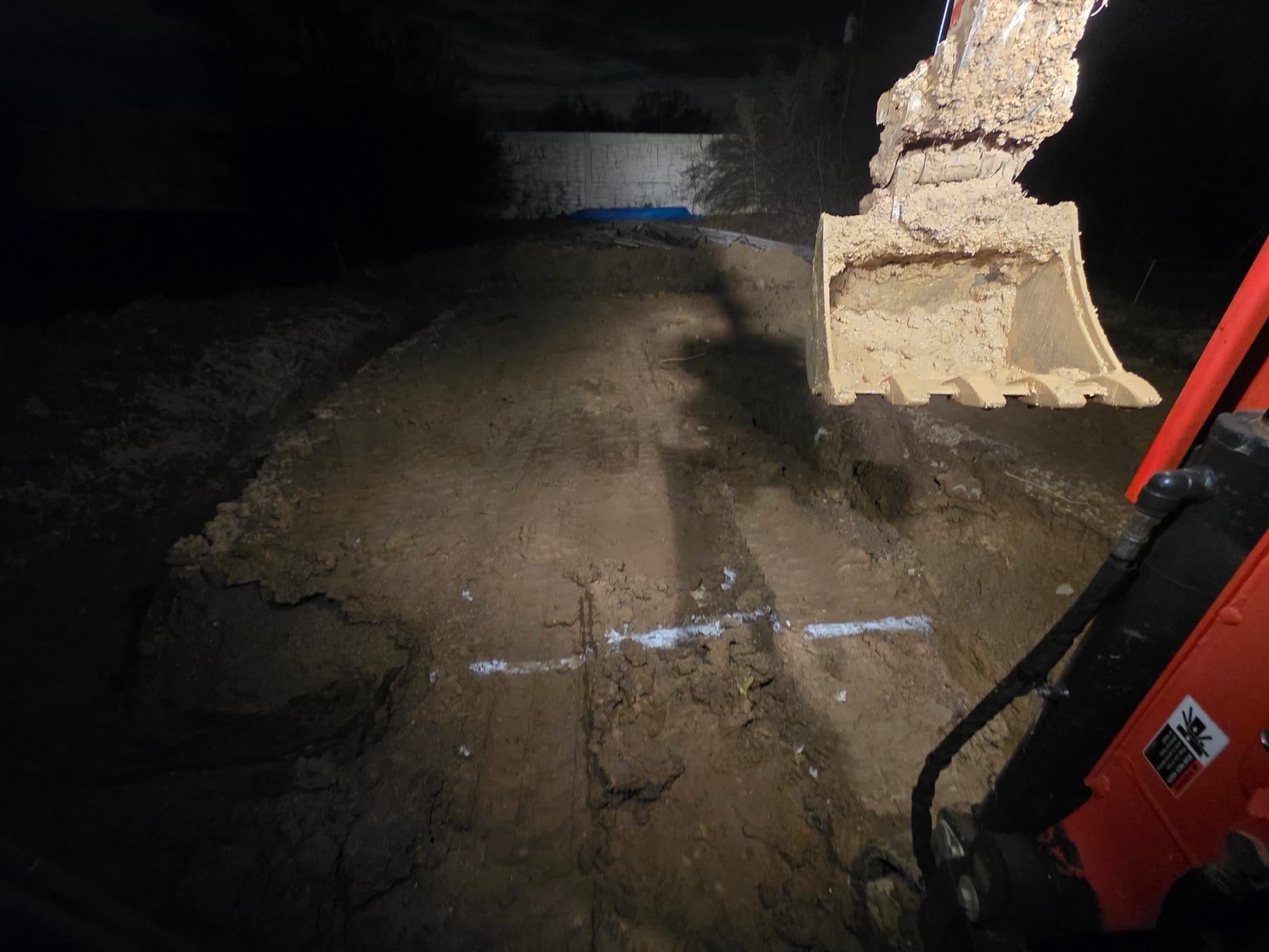 Footer excavation continuing after dark