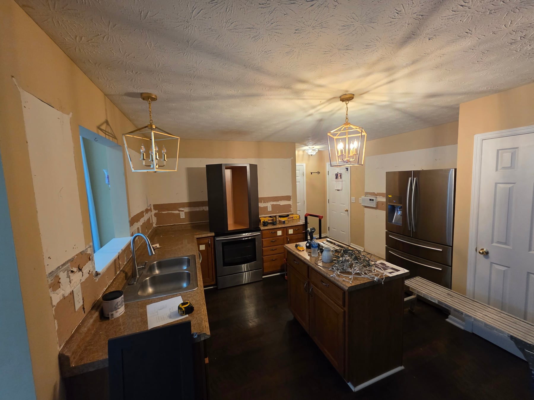 Kitchen after all existing cabinets and countertops were removed