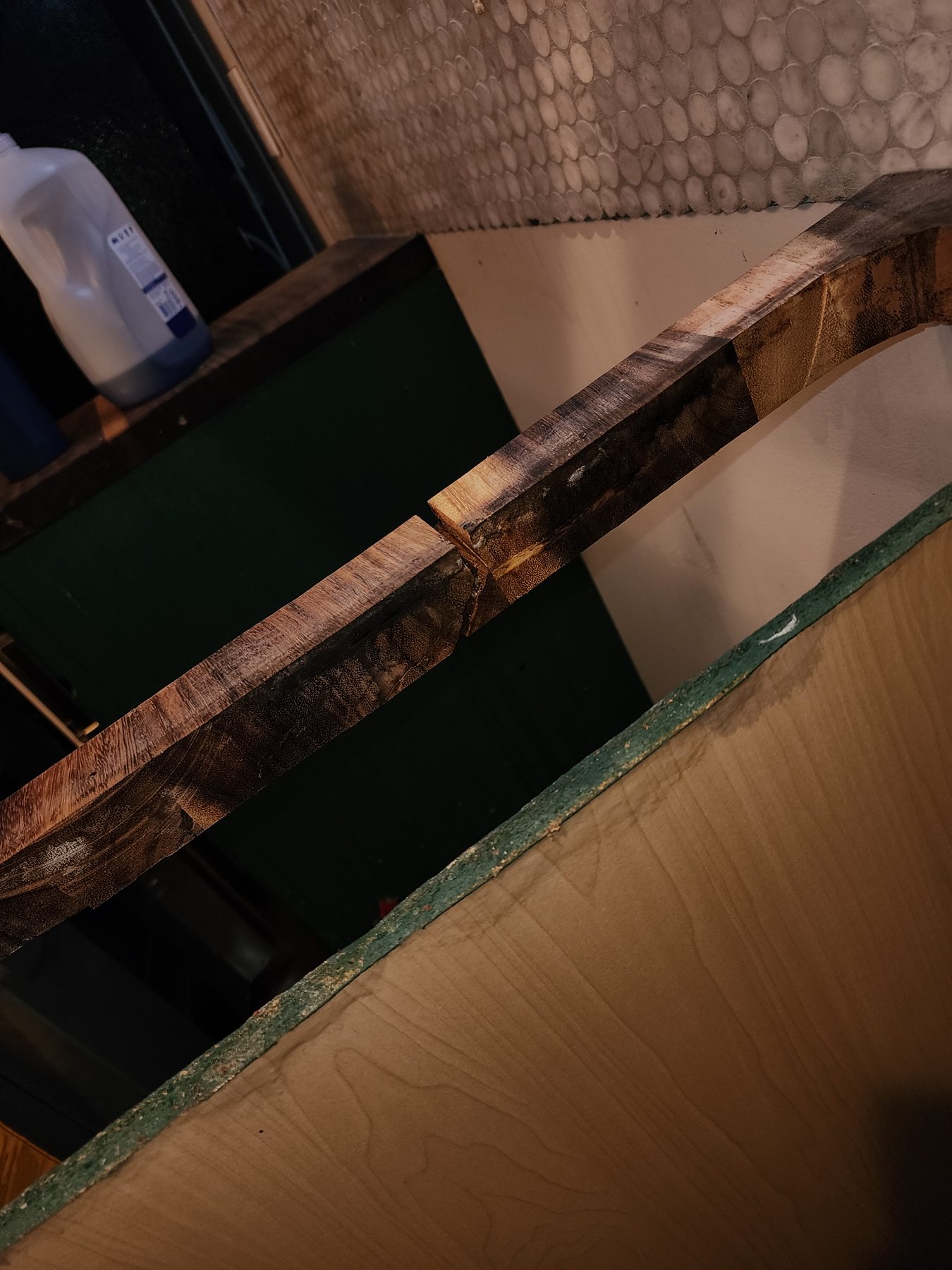 Separated and damaged joint in the live-edge wood countertop