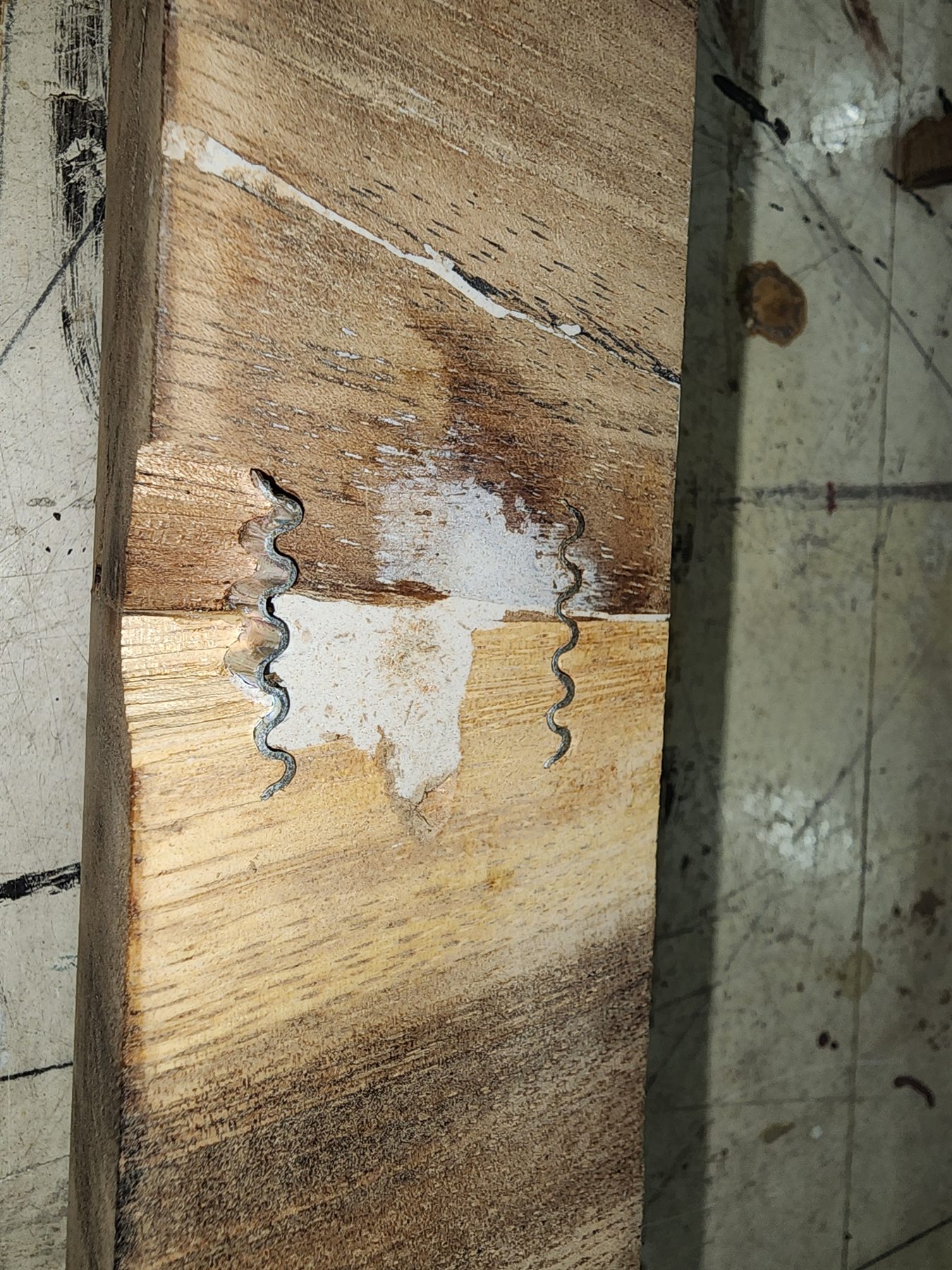 Mechanical stitching used to stabilize a crack in the wood countertop
