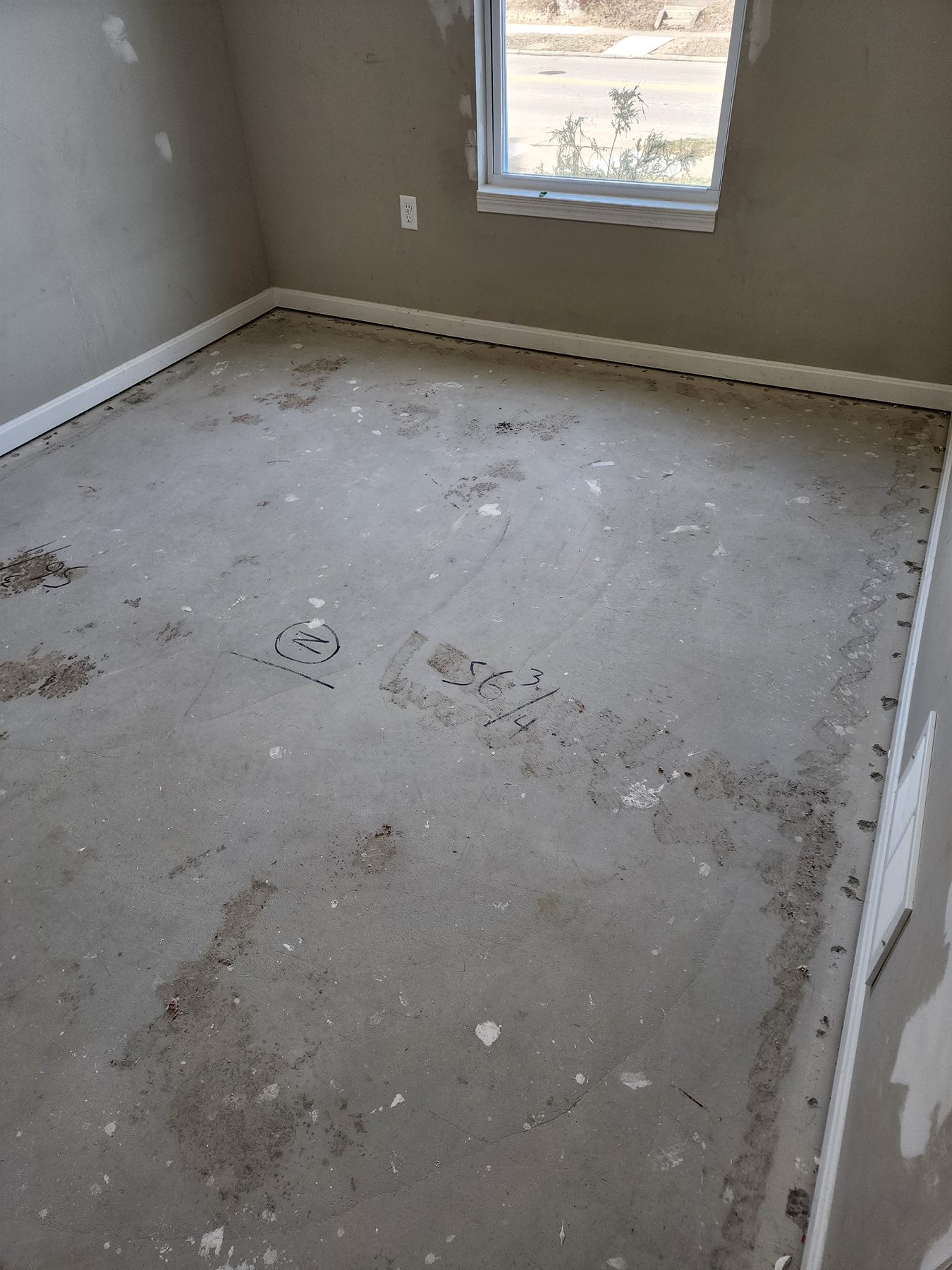 Marked subfloor area during repair preparation