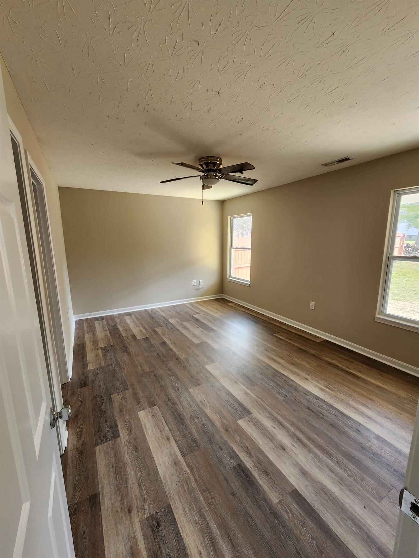 Finished bedroom with fresh paint and LVP flooring