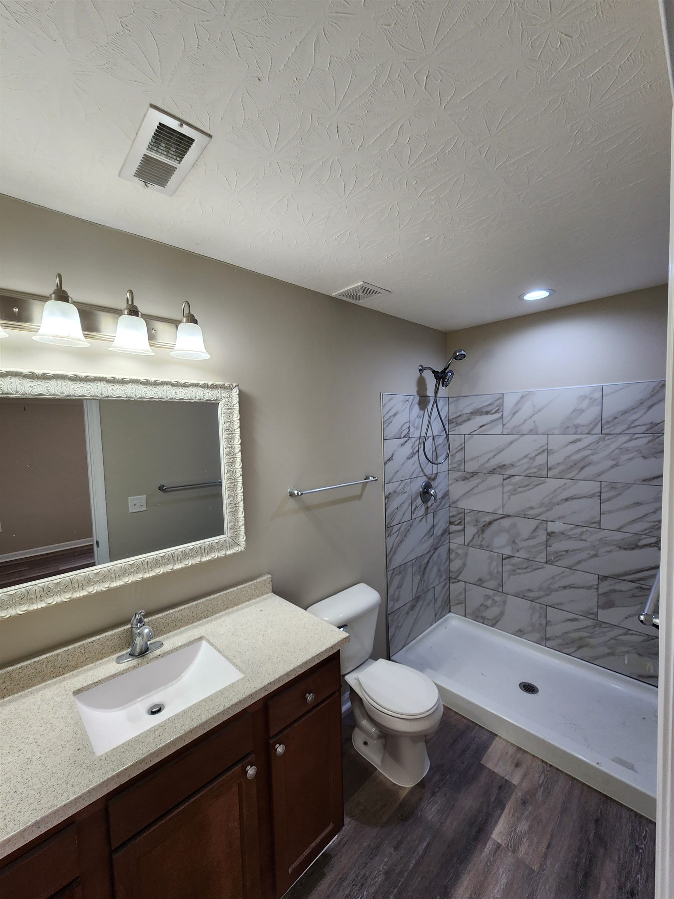 Finished bathroom with repaired surround and refreshed fixtures