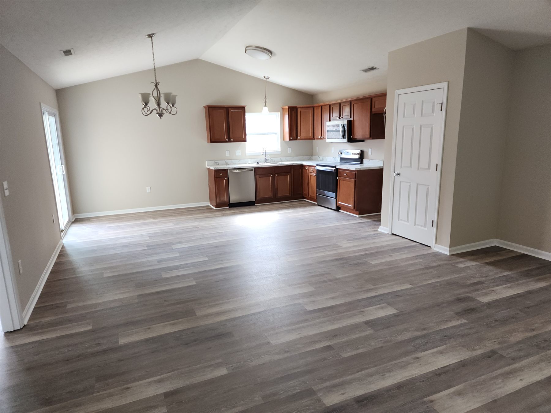 Completed kitchen opening into the renewed living space