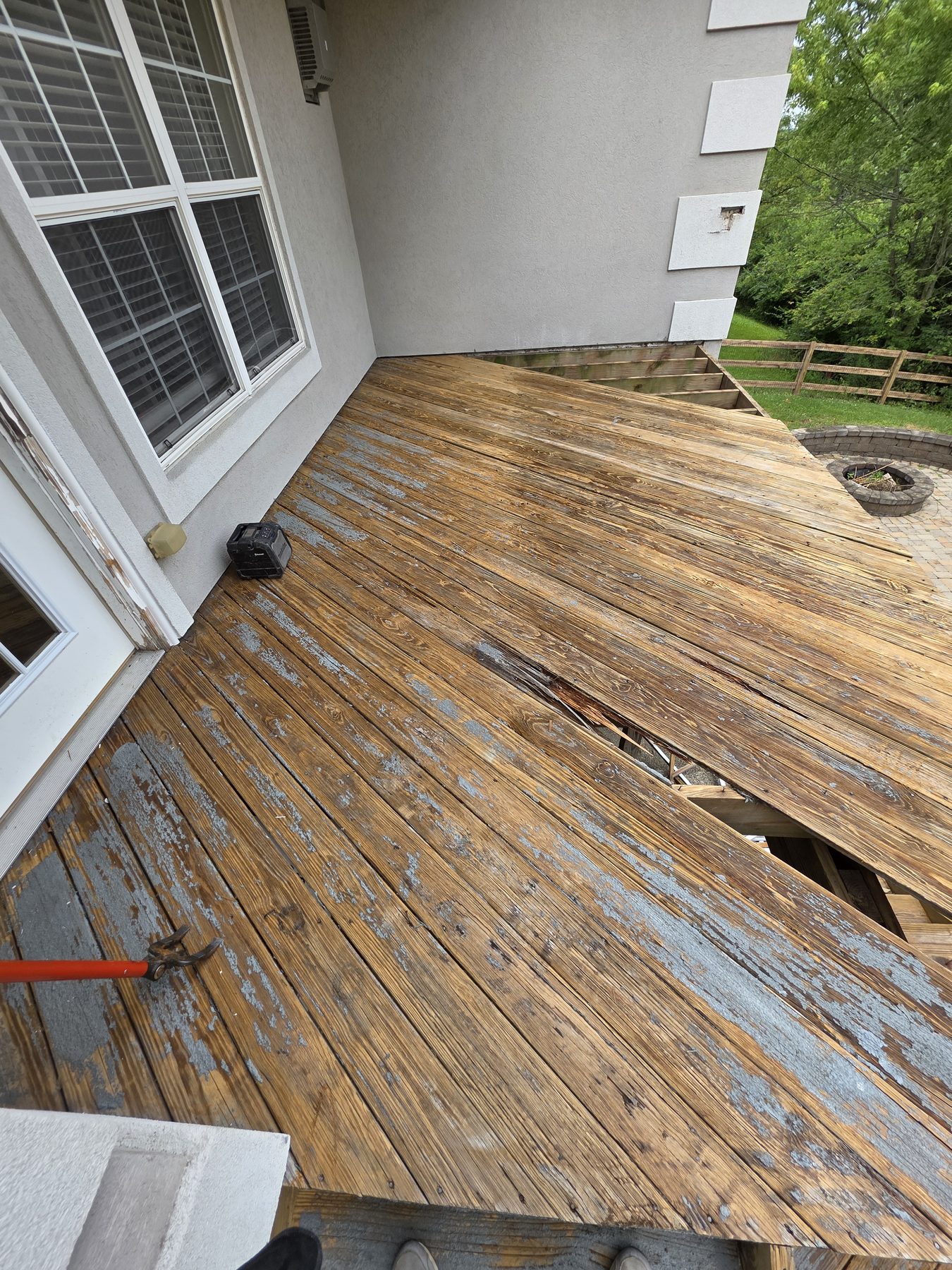 Deteriorated deck boards before replacement