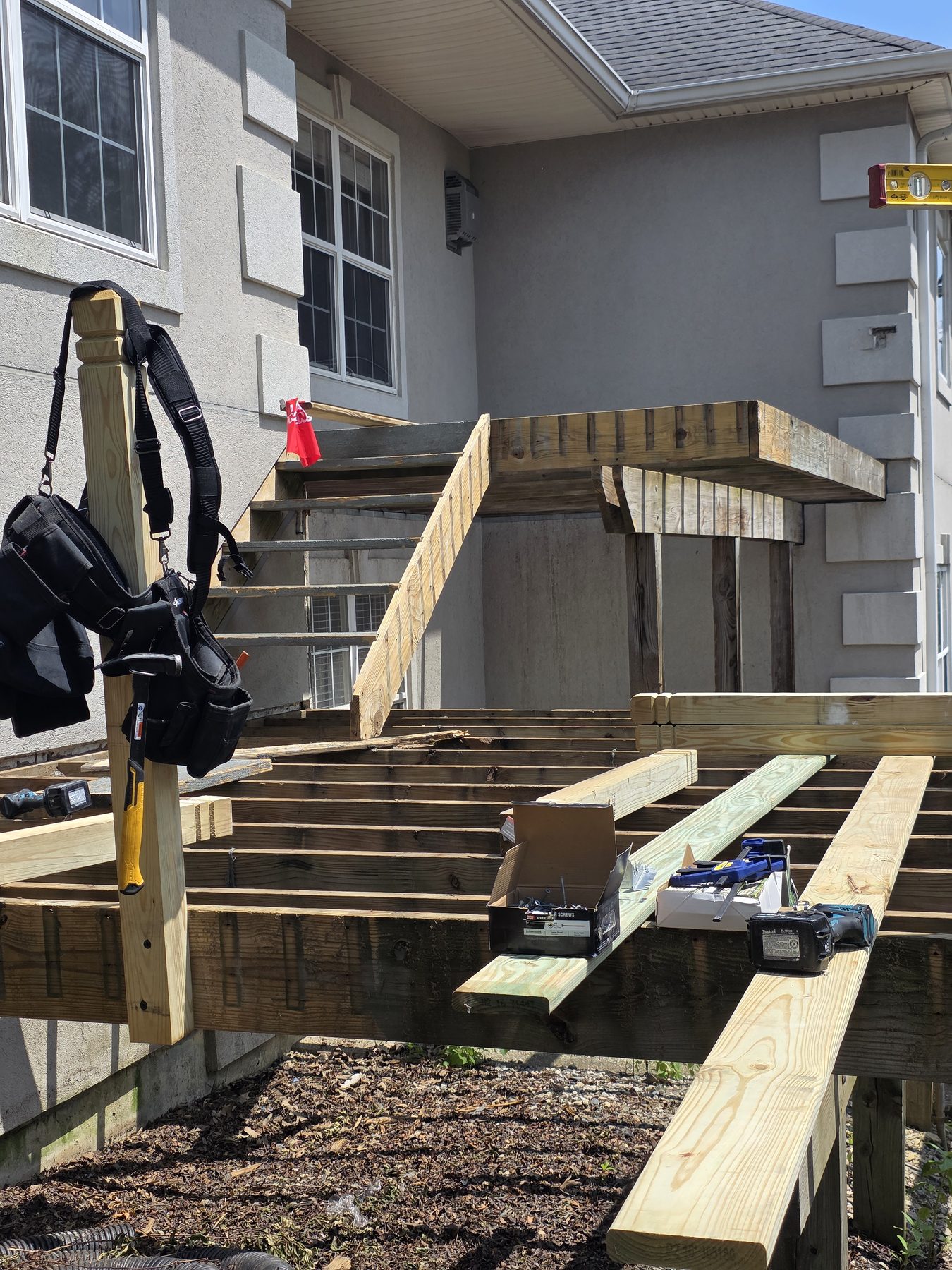 Exposed deck framing during replacement work
