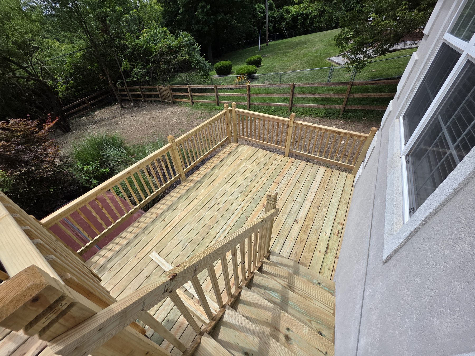 Wide view of the renewed deck and perimeter railings