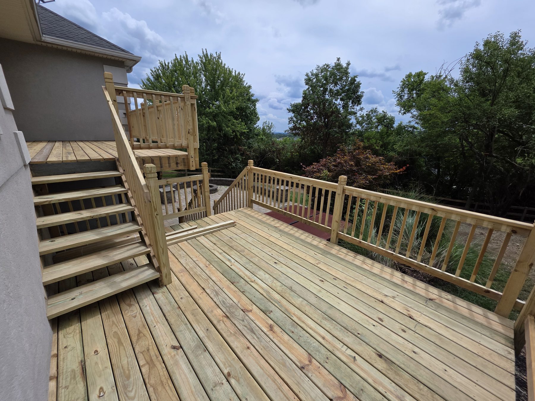 Completed multilevel deck with stairs and railings
